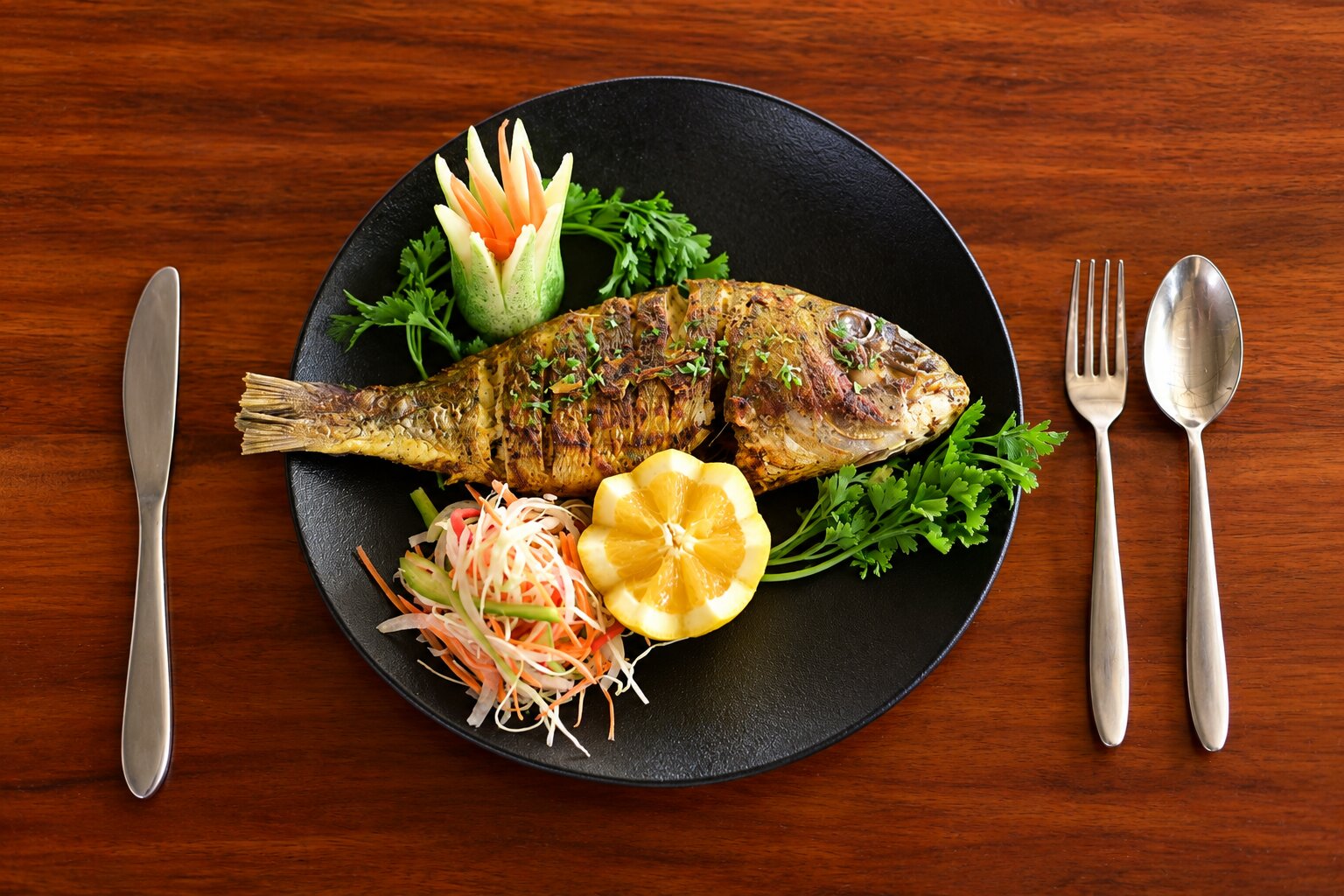 Grilled fish with lemon and fresh salad