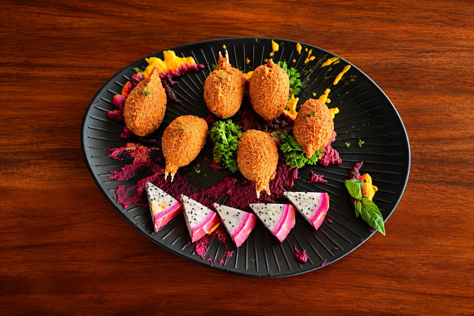 Crispy croquettes with vibrant vegetable garnish